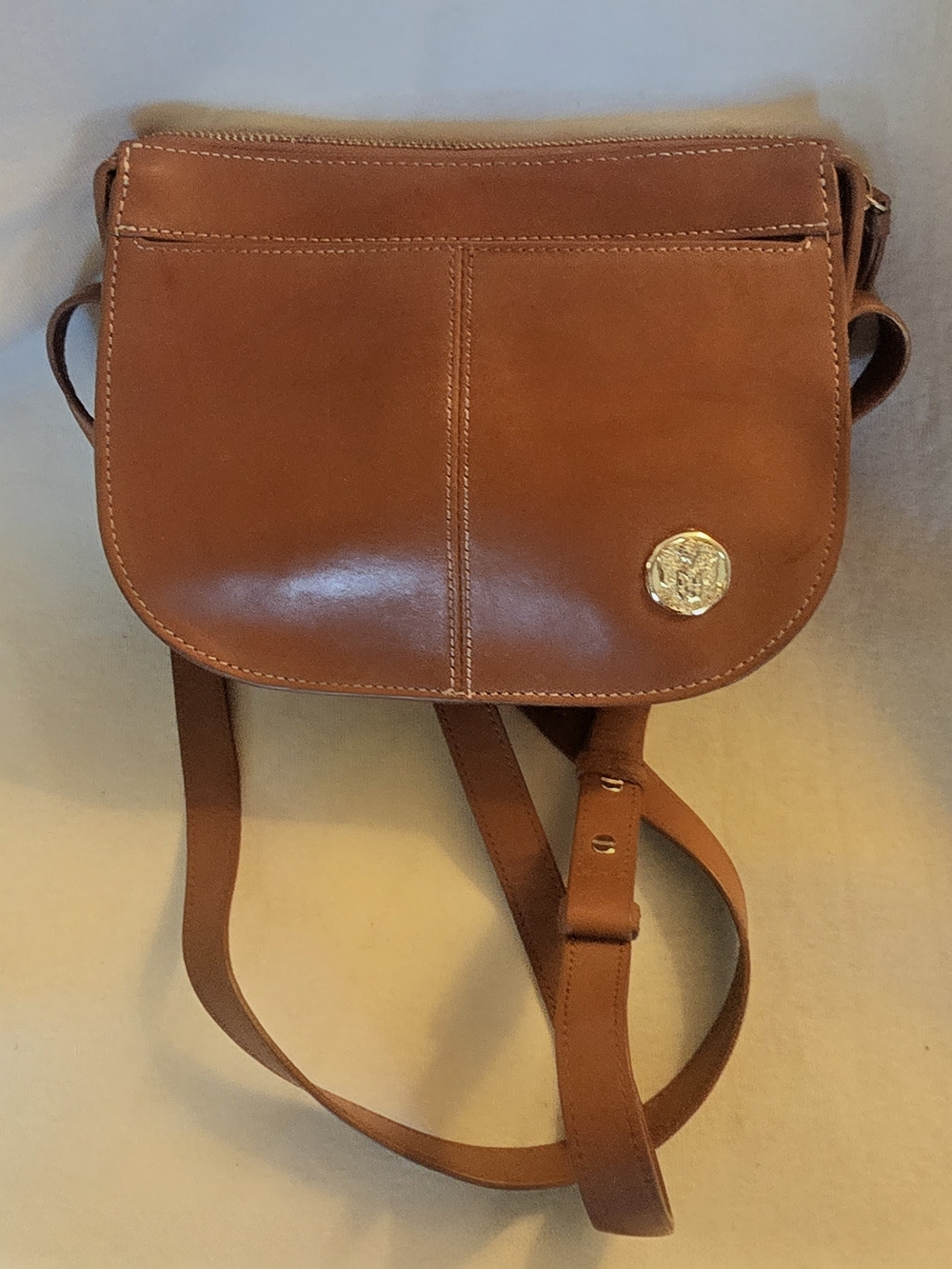 Tan Leather Crossbody Saddle Bag with Gold Emblem -- Vince Camuto